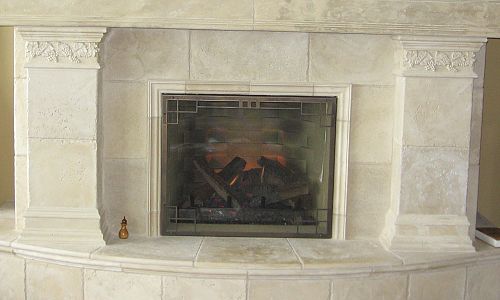 <p>Escape 36 gas fireplace with custom cast surround</p>