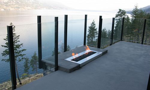 This custom made linear gas burner with crushed glass was manufactured by Okanagan Fireplace Den and Installed into a stunning Rykon Homes show home in Kelowna