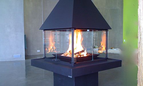 <p>This 4 sided wood fireplace was installed into a ultra modern home on Kelowna's Lakeshore. With 4 full sides to view the fire, it is the ultimate centre piece</p>