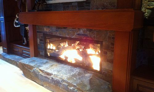 Xtreme gas fireplace with drift wood media 